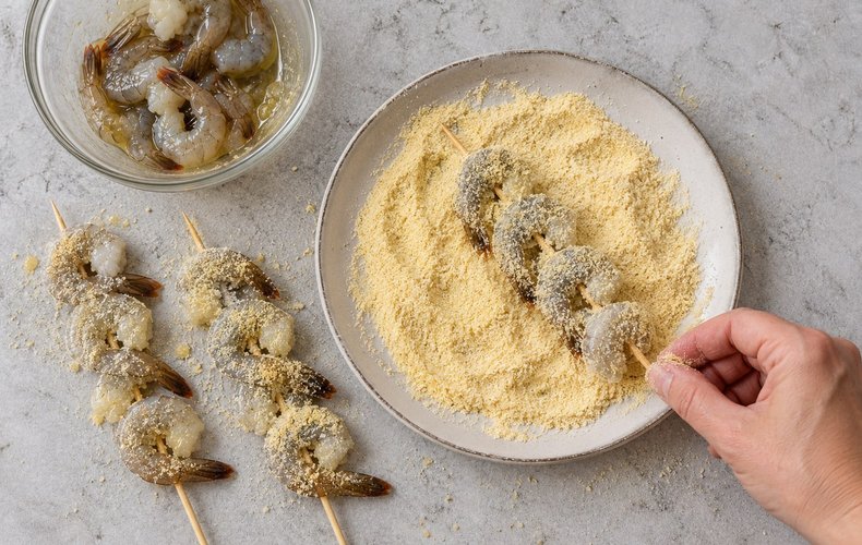 Air Fryer Shrimp Skewers, step 3: skewers rolled in durum wheat semolina