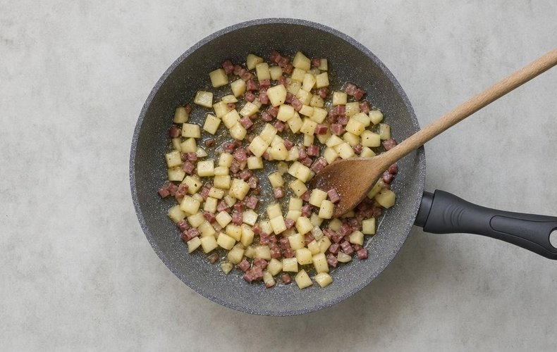 Apple and Speck Risotto, step 3: diced apples and speck browning in a pan
