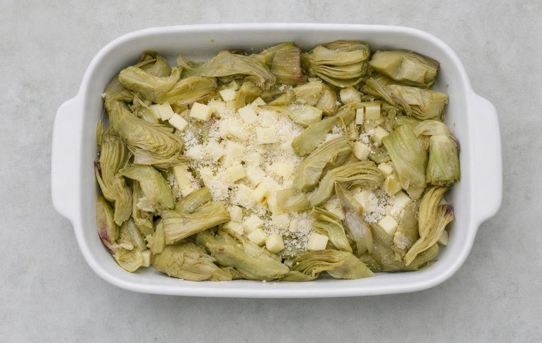 Baked Artichoke Casserole, step 4: beaten eggs poured over the artichokes