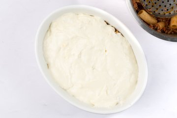 Béchamel spread over a layer of pasta