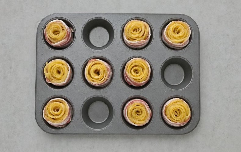 Baked Potato and Bacon Roses, step 4: a potato rose wrapped in bacon in a muffin pan