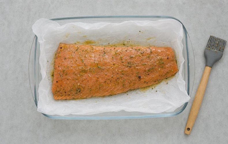 Baked Salmon, step 3: salmon brushed with the sauce in a lined baking dish