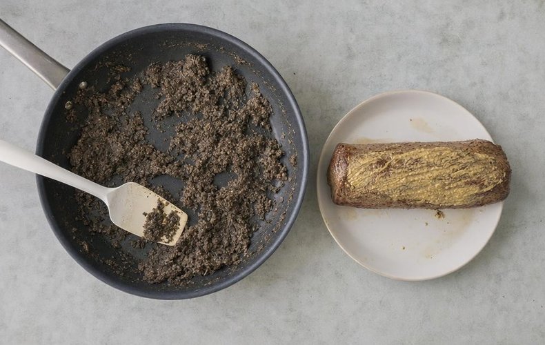 Beef Wellington, step 4: the seared tenderloin brushed with mustard