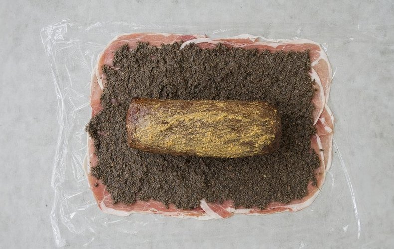 Beef Wellington, step 5: the tenderloin on prosciutto spread with mushroom paste