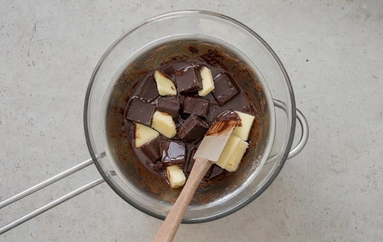 Brownie Trifle with Mascarpone Cream, step 1: chopped chocolate melting with butter in a double boiler