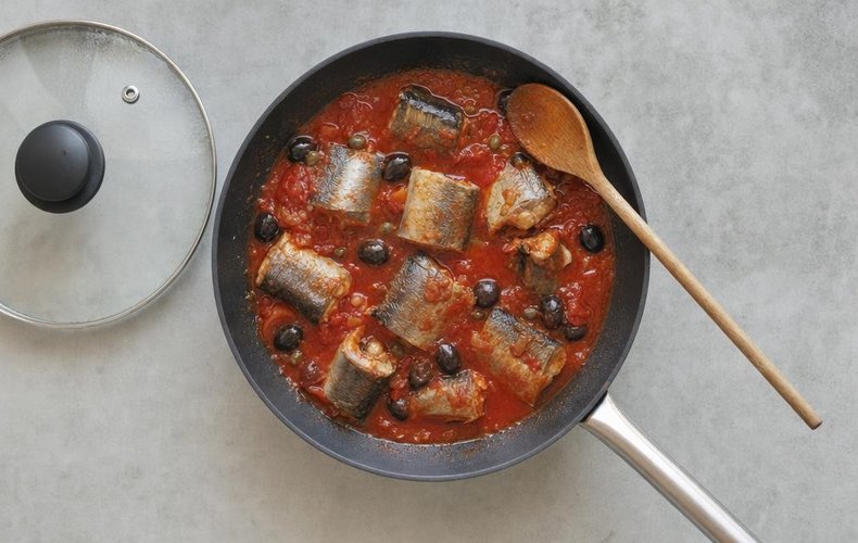 Calabrian Capitone Eel in Tomato Sauce, step 3: capitone simmering in tomato sauce with olives and capers