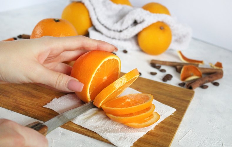 Oranges cut into thin slices with the peel on