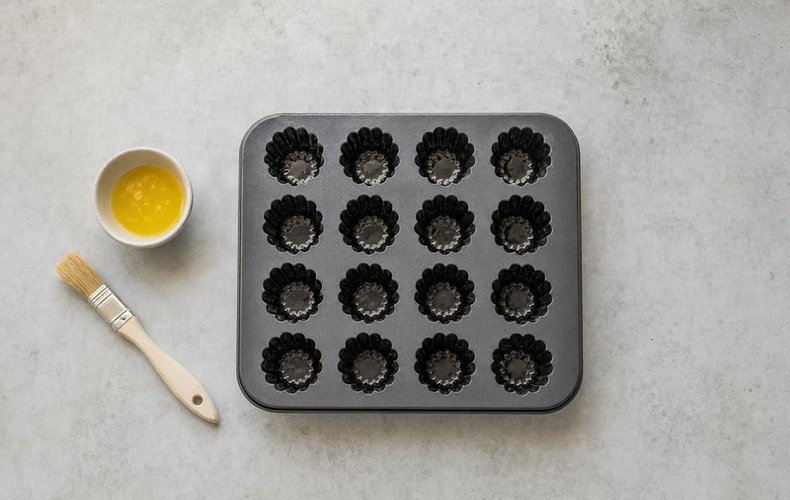 Canelés, step 4: canelé mold greased with melted butter