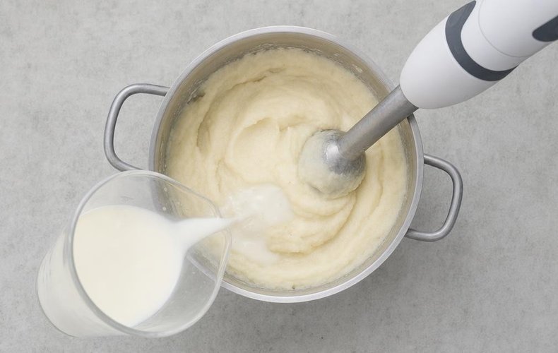 Cauliflower Puree, step 3: blending the vegetables with the milk using an immersion blender