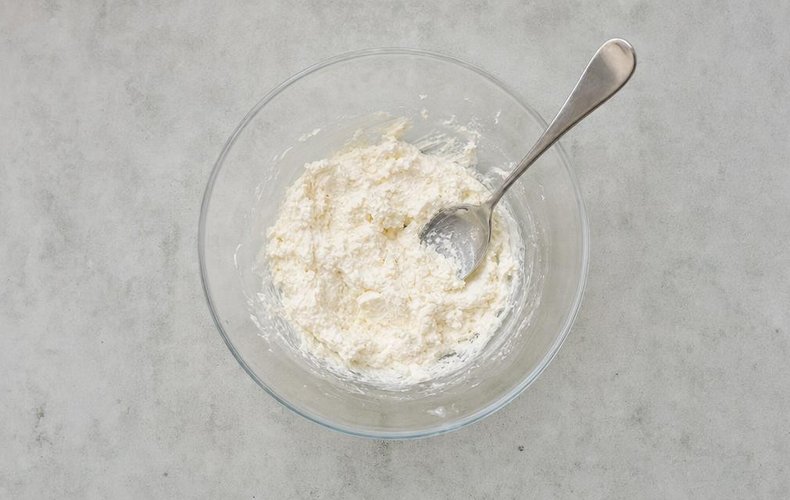 Cheese and Herb Christmas Trees, step 1: goat cheese, cream cheese and Parmigiano mixed in a bowl