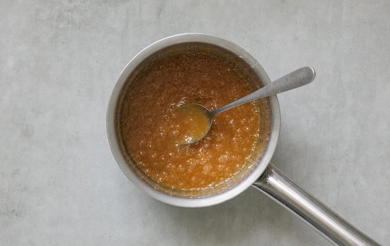Chocolate Caramel Apples, step 4: caramel sauce cooking in a saucepan