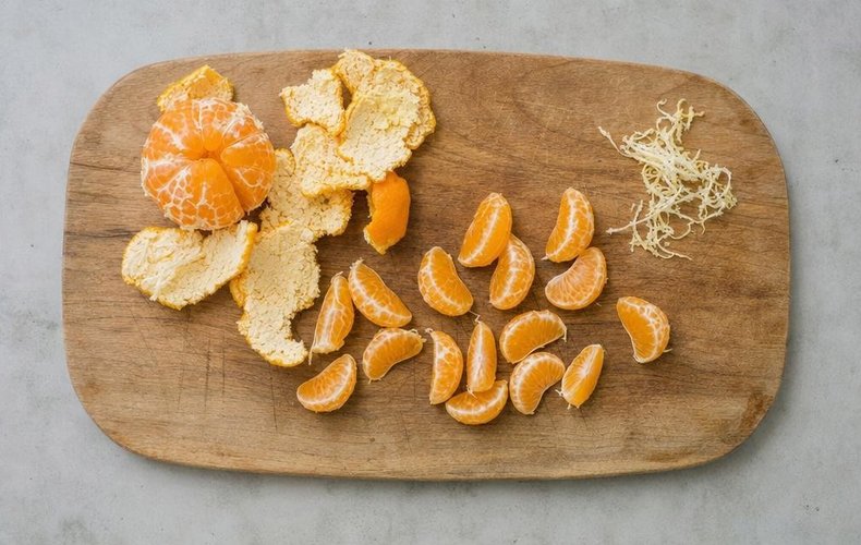 Chocolate-Dipped Mandarins, step 1: mandarins peeled and separated into segments
