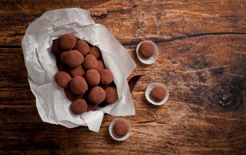 Cocoa-dusted chocolate truffles with a whole hazelnut inside