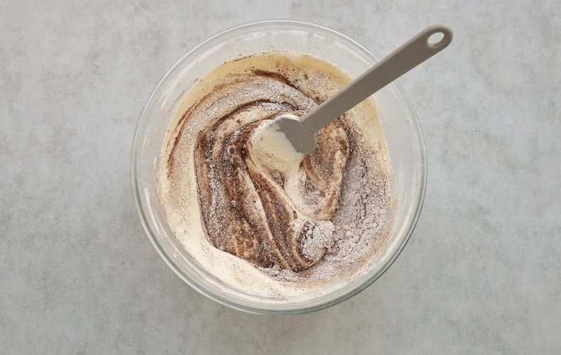 Chocolate Roll with Mascarpone Cream, step 1: flour and cocoa folded into the whipped eggs and sugar