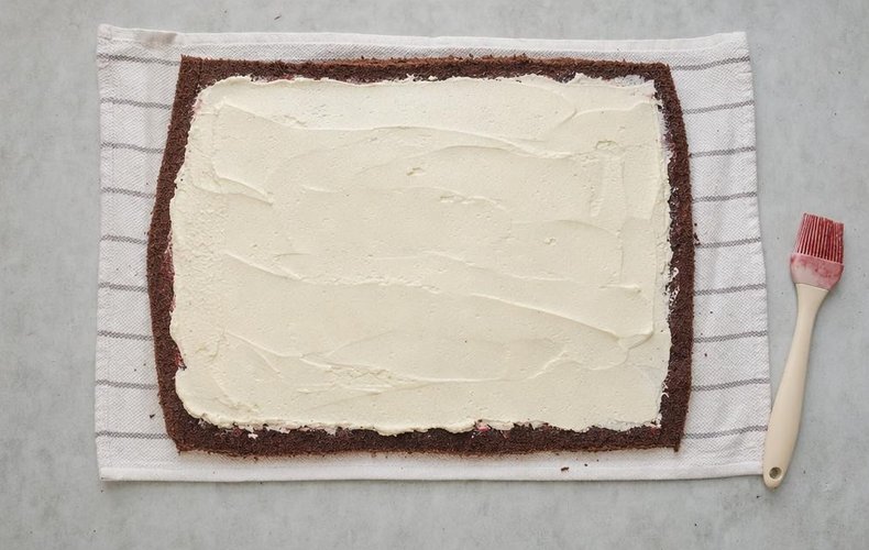 Chocolate Roll with Mascarpone Cream, step 5: sponge brushed with Alchermes and spread with mascarpone cream
