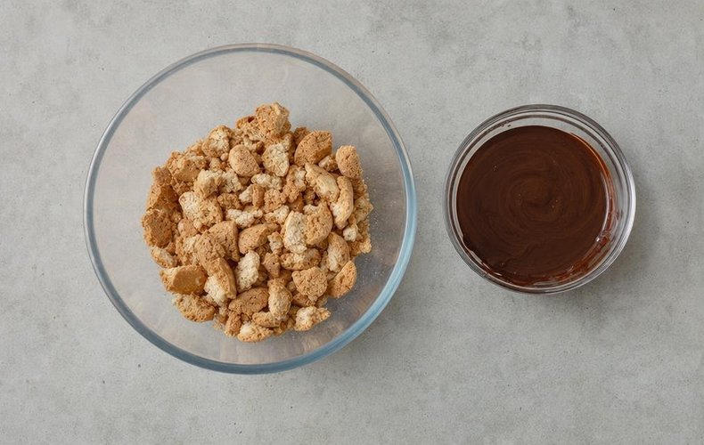 Chocolate Salami with Amaretti Cookies, step 1: amaretti broken up by hand in a bowl