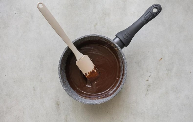 Chocolate Truffles with a Hazelnut Center, step 2: dark chocolate melting into the hot cream