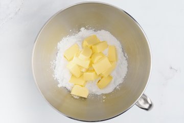 Powdered sugar and cold butter in the stand mixer bowl