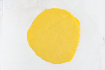 Cutting out pastry decorations with cookie cutters