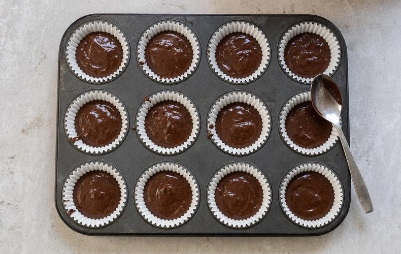 Christmas Reindeer Muffins, step 3: chocolate batter in paper liners in a muffin pan