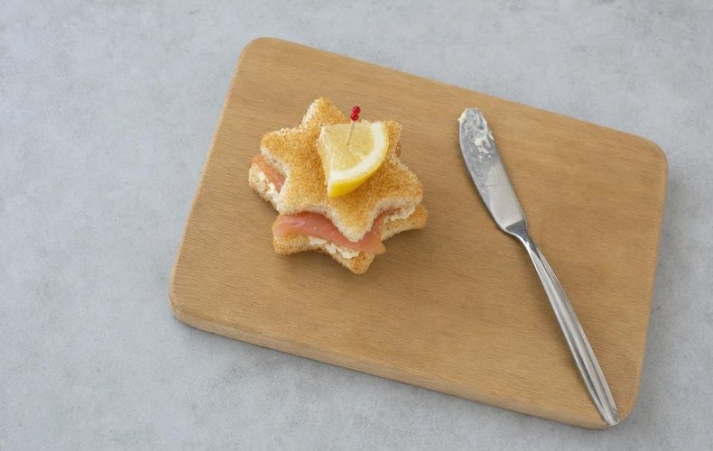 Christmas Star Mini Sandwiches, step 3: a buttered star topped with smoked salmon