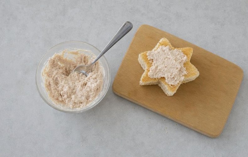 Christmas Star Mini Sandwiches, step 4: tuna and mayonnaise spread on a star