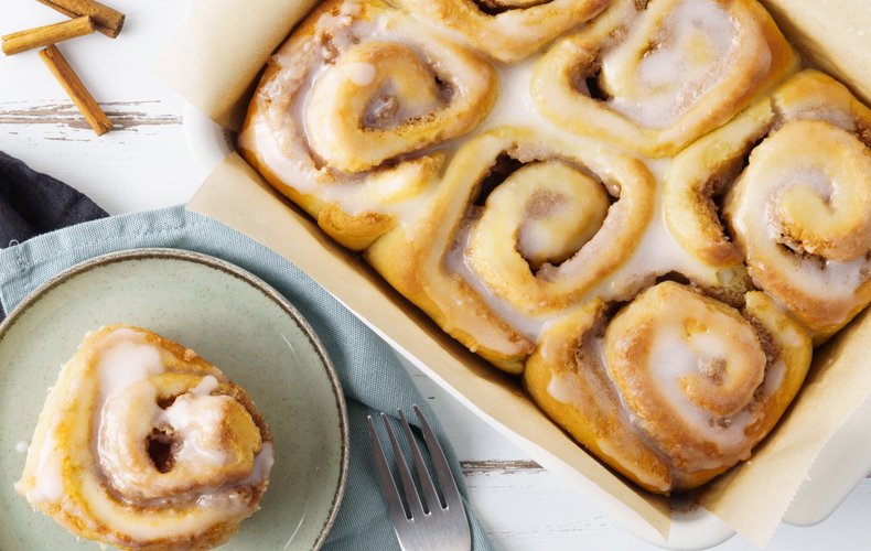 Cinnamon rolls covered with sugar glaze