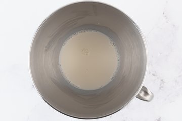 Fresh yeast and sugar in lukewarm milk for cinnamon rolls