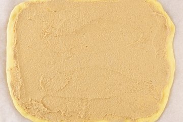 Rolling up the dough with the cinnamon filling
