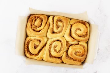 Baked cinnamon rolls cooling