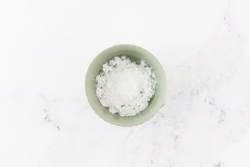 Powdered sugar and water in a bowl for the glaze