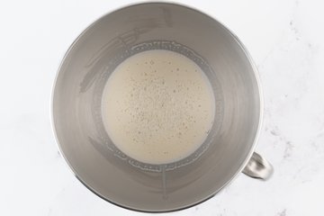 Yeast dissolved in milk for the cinnamon roll dough