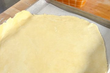 Top crust on a parchment-lined baking sheet