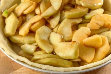 Apple filling piled into the pie shell