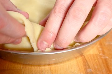 Top crust laid over the apple filling