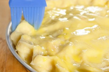 Apple pie sprinkled with sugar, ready to bake