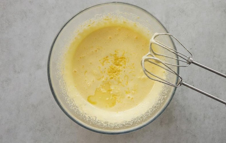 Classic Charlotte Royale, step 1: egg yolks beaten with sugar and hot water