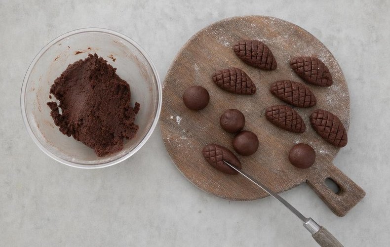 Cocoa Pinecone Cookies, step 6: scoring diagonal lines with the back of a knife