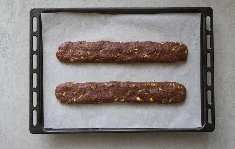 Cocoa and Pistachio Cantucci, step 2: shaping the dough into logs on a baking sheet