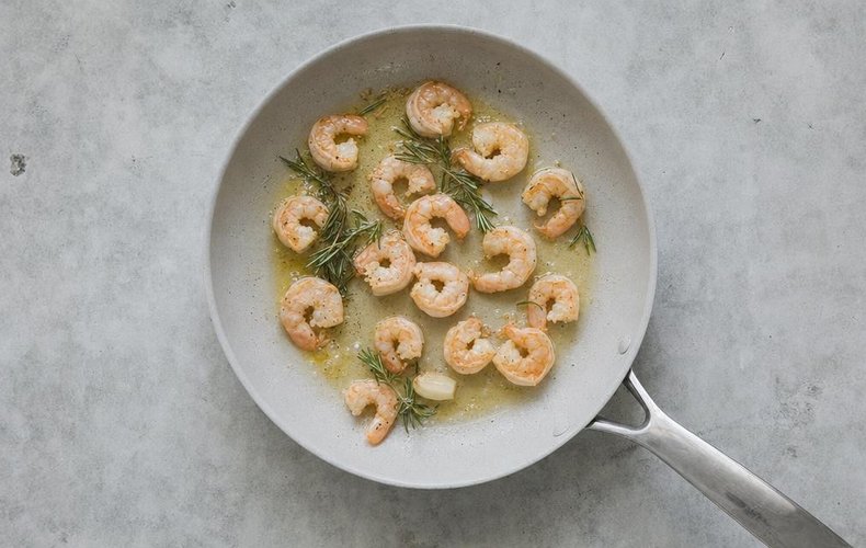 Creamy Shrimp Tagliatelle, step 2: shrimp browning in a pan with rosemary