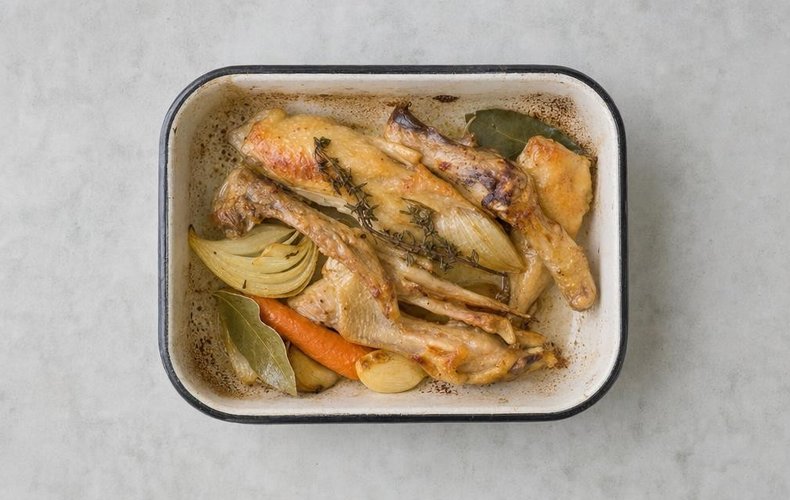 Duck à l'orange, step 2: wings and neck with carrot, onion, garlic, thyme and bay leaves