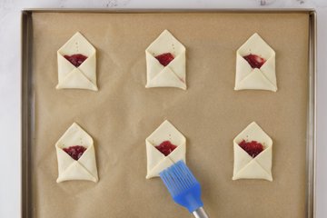 Envelopes sprinkled with granulated sugar, ready to bake