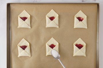 Baked golden pastry envelopes