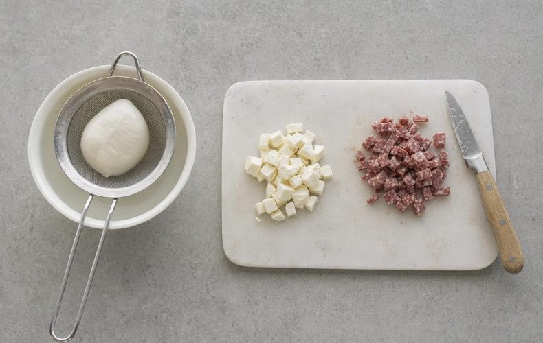 Filled Puff Pastry Stars, step 1: diced mozzarella and salami