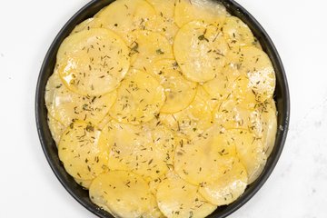 Sprinkling with chopped herbs before baking