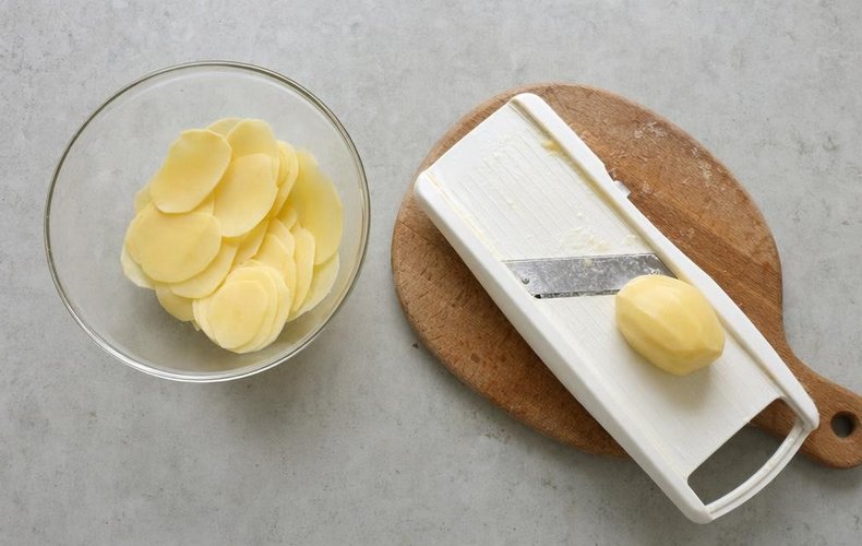 Four Cheese Potatoes, step 1: potatoes thinly sliced with a mandoline