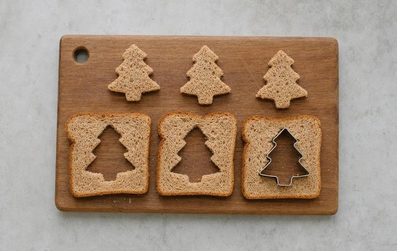 Frittata-in-a-Hole Toasts, step 4: Christmas tree shapes cut out of sandwich bread slices
