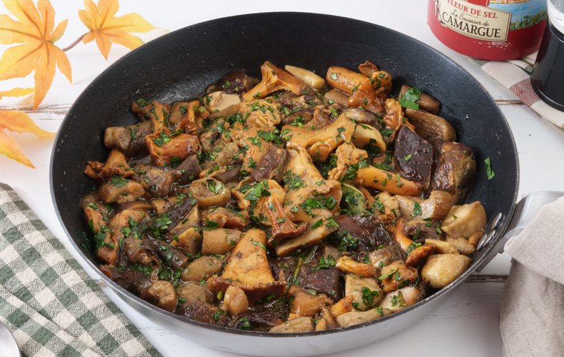 Funghi trifolati in a skillet