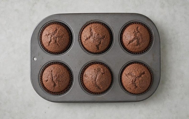 Gingerbread Cupcakes, step 4: batter in paper liners in a muffin pan