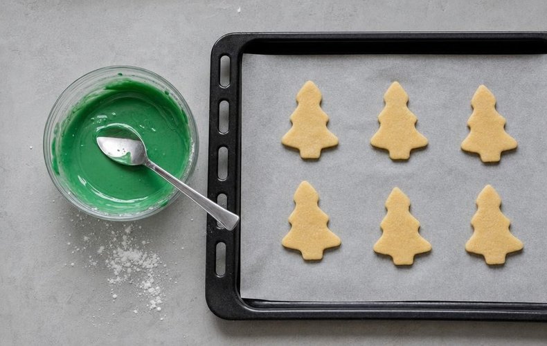 Glazed Christmas Tree Cookies, step 3: green icing in a bowl